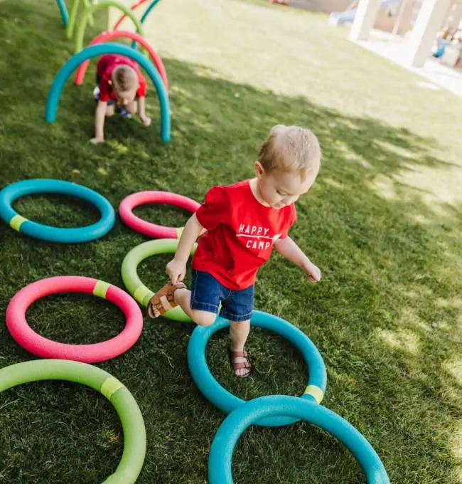kid playing in the grass